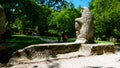 View of the Park of the Monsters of Bomarzo with a bear sculpture in the foreground, a natural park adorned with numerous basalt s