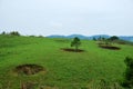 Bomb craters from the Vietnam War surround giant megalithic stone urns at the Plain of Jars archaeological site in Loas.