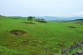 Bomb craters from the Vietnam War surround giant megalithic stone urns at the Plain of Jars archaeological site in Loas.