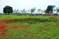 Bomb craters from the Vietnam War surround giant megalithic stone urns at the Plain of Jars archaeological site in Loas.