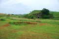 Bomb craters from the Vietnam War surround giant megalithic stone urns at the Plain of Jars archaeological site in Loas.