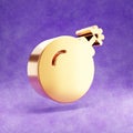 Bomb icon. Gold glossy Bomb symbol isolated on violet velvet background.