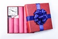 Bomb sticks of dynamite, in a gift box with a blue ribbon with c Royalty Free Stock Photo
