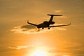 The Bombardier BD-700-1A11 Global 5000 M-KBSD) flying in sunset sky Royalty Free Stock Photo