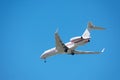 Bombardier BD-700-1A11 private small business jet preparing for landing at airport with deployed landing gear. - San Jose,