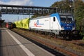 A Bombardier Class 187 locomotive is waiting with a freight train for departure at Marburg station.