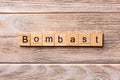 Bombast word written on wood block. bombast text on wooden table for your desing, concept Royalty Free Stock Photo