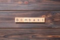 Bombast word written on wood block. bombast text on cement table for your desing, concept Royalty Free Stock Photo