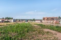 Bombed buildings on a weedy Ploshcha 40-Yi Armiyi square in Trostianets Royalty Free Stock Photo