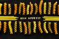Bon Appetit page spelled by pasta, on black Royalty Free Stock Photo
