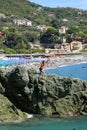 Bonassola, Italy - summer2020: guys dive from a cliff into the sea of the five lands