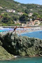 Bonassola, Italy - summer2020: guys dive from a cliff into the sea of the five lands