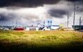 East Coast historic memorial church and water towers overlooking an empty field under a stormy sky. Royalty Free Stock Photo