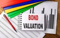 BOND VALUATION text on notebook with folder on chart Royalty Free Stock Photo