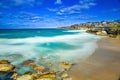 Bondi Beach in Sydney NSW Australia on a sunny winters day partly cloudy skies Pacific Ocean waves and nice sandy beach