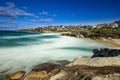 Bondi Beach in Sydney NSW Australia on a sunny winters day partly cloudy skies Pacific Ocean waves and nice sandy beach