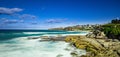 Bondi Beach in Sydney NSW Australia on a sunny winters day partly cloudy skies Pacific Ocean waves and nice sandy beach