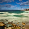 Bondi Beach in Sydney NSW Australia on a sunny winters day partly cloudy skies Pacific Ocean waves and nice sandy beach