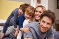 Bonding before bedtime. Portrait of a young family being playful at home.