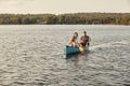 Bonding on a boat. a young couple rowing a boat out on the lake. Royalty Free Stock Photo