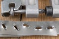 Bonding a sheet metal using a crimper. Small locksmith works in Royalty Free Stock Photo