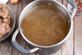 Bone Broth Bouillon in Metal saucepan on the table  paleo diet Royalty Free Stock Photo