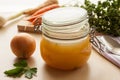 Bone broth made from chicken in a glass jar Royalty Free Stock Photo