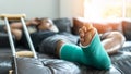 Bone fracture foot and leg on male patient with splint cast and crutches during surgery rehabilitation and orthopaedic recovery Royalty Free Stock Photo