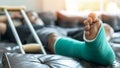 Bone fracture foot and leg on male patient with splint cast and crutches during surgery rehabilitation and orthopaedic recovery Royalty Free Stock Photo