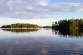 View of calm water and tree covered islands in Canada