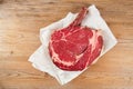 Bone-in Rib eye Steak steak on paper Royalty Free Stock Photo