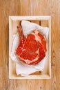 Bone-in Rib eye Steak steak on paper Royalty Free Stock Photo