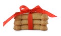 Bone shaped dog cookies with red bow isolated on white Royalty Free Stock Photo