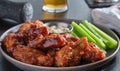 Boneless chicken wings covered in honey garlic bbq sauce with ranch and celery Royalty Free Stock Photo