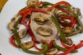 boneless pork chop with sauteed mushrooms and peppers Royalty Free Stock Photo