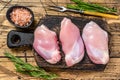 Boneless Raw Chicken thigh fillet. Wooden background. Top view Royalty Free Stock Photo