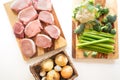 Boneless raw pork loin chops, fresh cauliflower, broccoli, celery, onion and garlic. Royalty Free Stock Photo