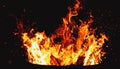 Bonfire burning at night, camp fire ant fire pit, flames and fire sparkles Royalty Free Stock Photo