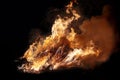 Bonfire burning trees at night. . Fire on black. Brightly, heat, light, camping, big bonfire Royalty Free Stock Photo