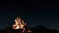 a bonfire burns at night against the background of mountains and sea with bright stars.. Royalty Free Stock Photo