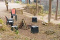 A bonfire at a camping site of a tourist resort. Empty plastic chairs arranged in a circle around the fire pit Royalty Free Stock Photo