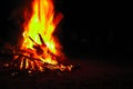 Bonfire on a dark background. Beautiful fire flames with copy space on black. Burning wood at night. Campfire at touristic camp. Royalty Free Stock Photo