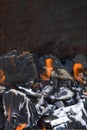 Bonfire embers. BBQ coals with fire. Close-up of the combustion process of wood, charcoal for barbecue