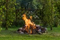 Bonfire in the garden with the grillage ready for a BBQ Royalty Free Stock Photo