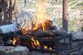 Bonfire in an iron barbecue grill picnic burns