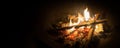 Bonfire, Log Fire, Or Campfire In Dark Background With Flame, Burned Log Wood, Firewood In Home Fireplace For Heating Or Camping