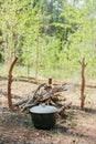 Bonfire next to the tourist camp. Journey into the wild concept. Royalty Free Stock Photo