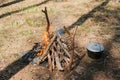 Bonfire next to the tourist camp. Journey into the wild concept. Royalty Free Stock Photo