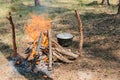 Bonfire next to the tourist camp. Journey into the wild concept. Royalty Free Stock Photo