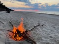 A bonfire by the sea on an empty beach Royalty Free Stock Photo